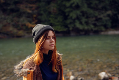 Portrait of beautiful young woman in hat