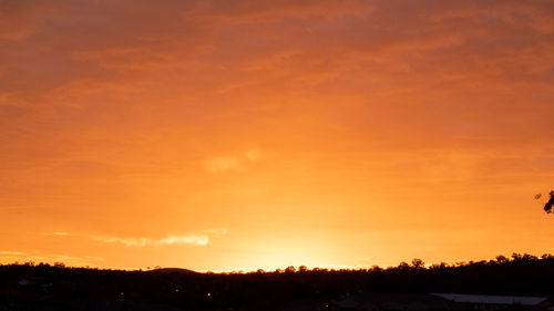 Scenic view of silhouette trees against sky during sunset