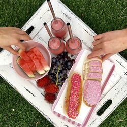 Cropped image of hands having breakfast at outdoors