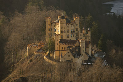 High angle view of buildings by river in town