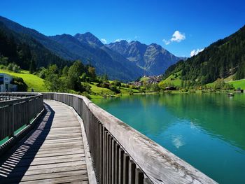 Scenic view of lake and mountains against sky