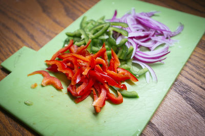 High angle view of chopped vegetables on cutting board