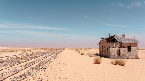 An abandoned home, weathered and broken.