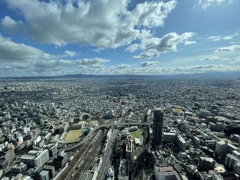 Aerial view of townscape against sky