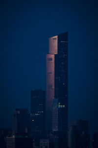 Modern buildings in city at night