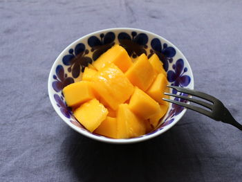 High angle view of oranges in bowl on table