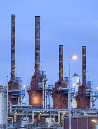 Factory against sky at night