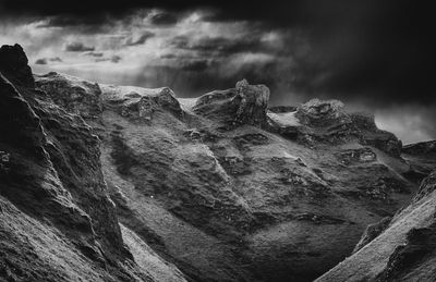 Low angle view of rock formation against sky