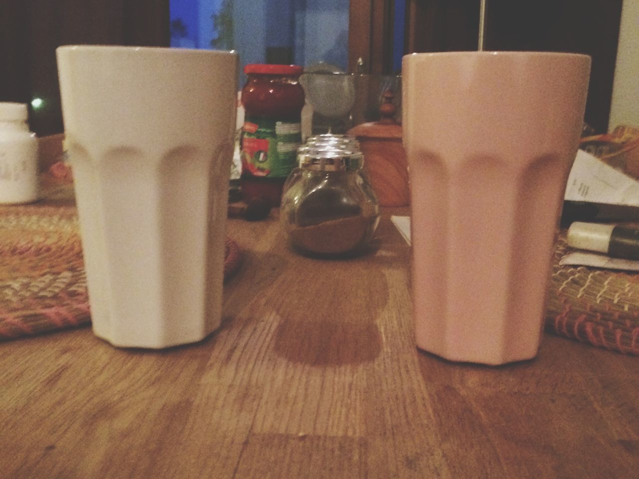 indoors, table, drink, still life, food and drink, wood - material, refreshment, drinking glass, home interior, freshness, coffee cup, close-up, wooden, no people, bottle, restaurant, focus on foreground, absence, coffee - drink, cup