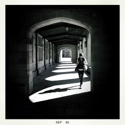 Full length of woman standing on railing