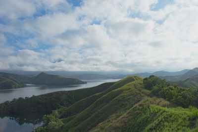 Scenic view of landscape and mountains against sky