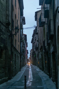 Narrow alley amidst buildings in city