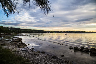 Scenic view of sea against cloudy sky