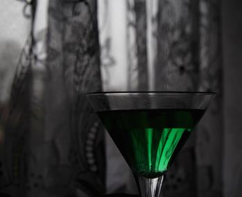 Close-up of beer glass on table