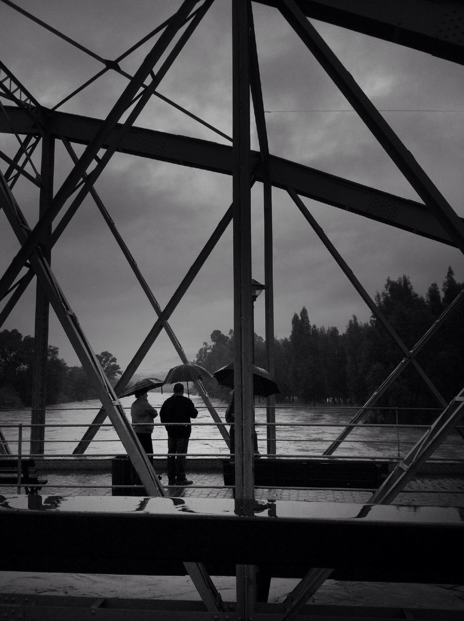 lifestyles, leisure activity, men, standing, rear view, full length, railing, sky, walking, person, built structure, silhouette, connection, architecture, casual clothing, bridge - man made structure, outdoors