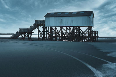 Bridge over sea against sky