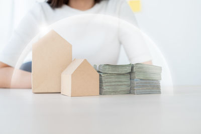 Stack of woman holding book