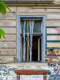 Low angle view of window of old building