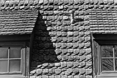 Low angle view of brick wall of house