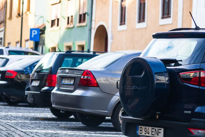 Cars parked on street in city