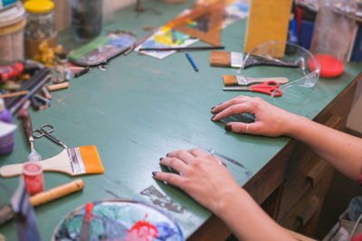 Cropped image of hands on table