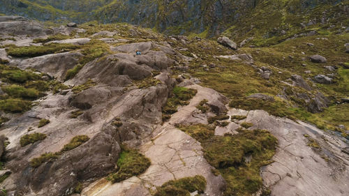 High angle view of stream flowing through rocks