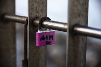 Close-up of padlock on railing