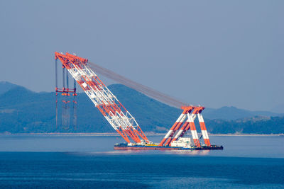 View of crane against sky