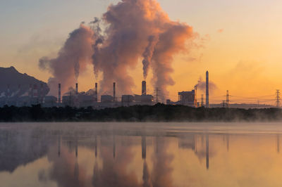 Smoke emitting from factory against sky, coal power plant