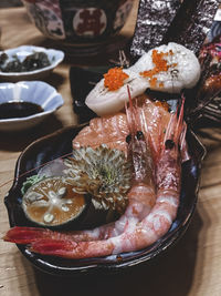 High angle view of fish in plate on table