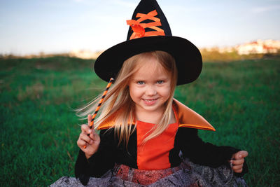 Portrait of smiling girl on field