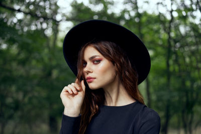 Portrait of young woman standing outdoors