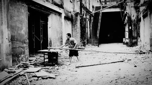 Full length of man on abandoned building