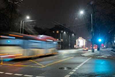 Blurred motion of illuminated street at night