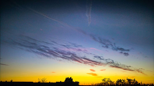 Low angle view of vapor trails in sky