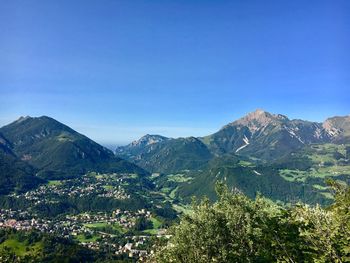 Scenic view of mountains against clear blue sky