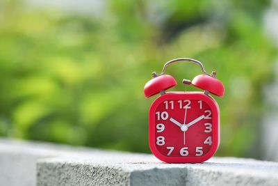 Close-up of clock on retaining wall