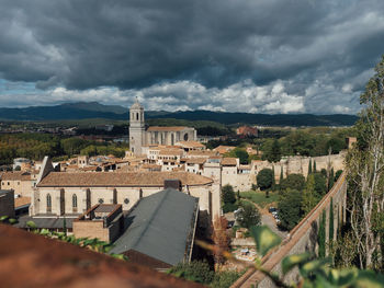 Buildings in city against sky