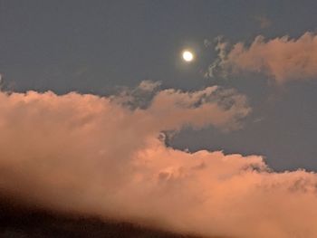 Low angle view of moon against sky at sunset