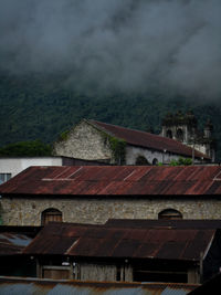 High angle view of houses and buildings against sky