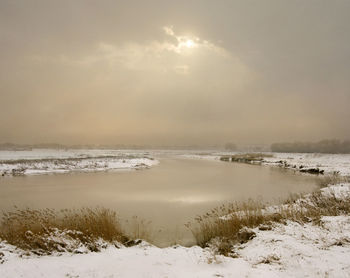 Scenic view of frozen sea against sky