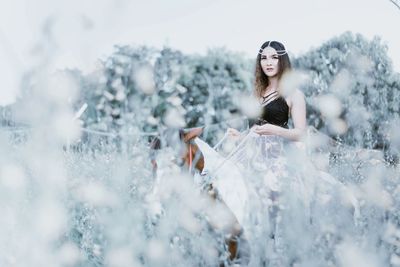 Portrait of young woman in snow