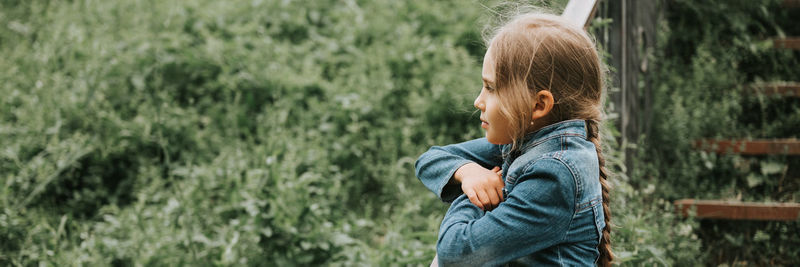 Happy candid kid girl in nature. prepubertal age of children, mind psychology and mental health