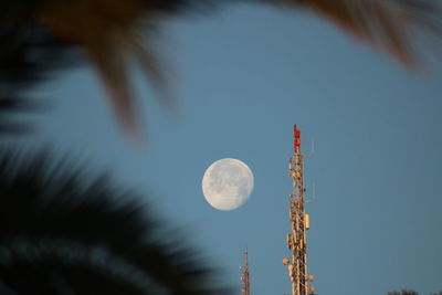 Low angle view of communications tower against sky