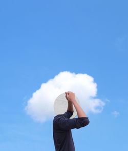 Low angle view of woman against sky
