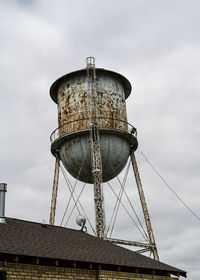 Low angle view of water tower against sky