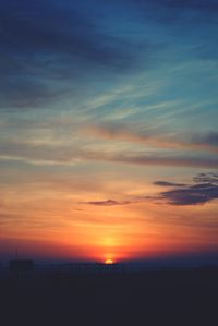 Scenic view of sea against romantic sky at sunset