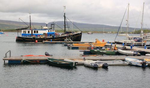 Boats moored at harbor