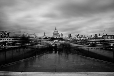 View of bridge over river in city