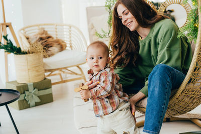 Interaction between an active toddler and a young mother at home. spending time together. 